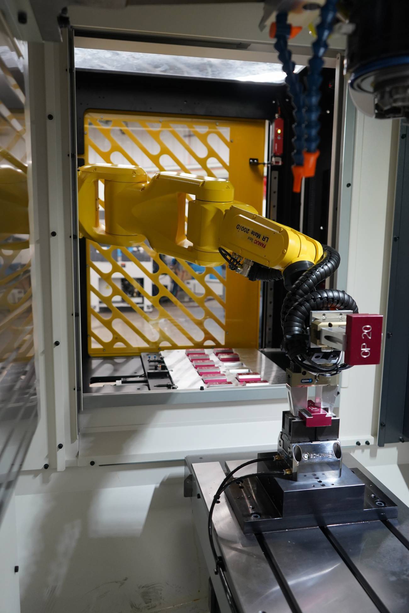 interior photo of the robotic arm within the FANUC Plus E Automation System sold by Methods Machine Tools