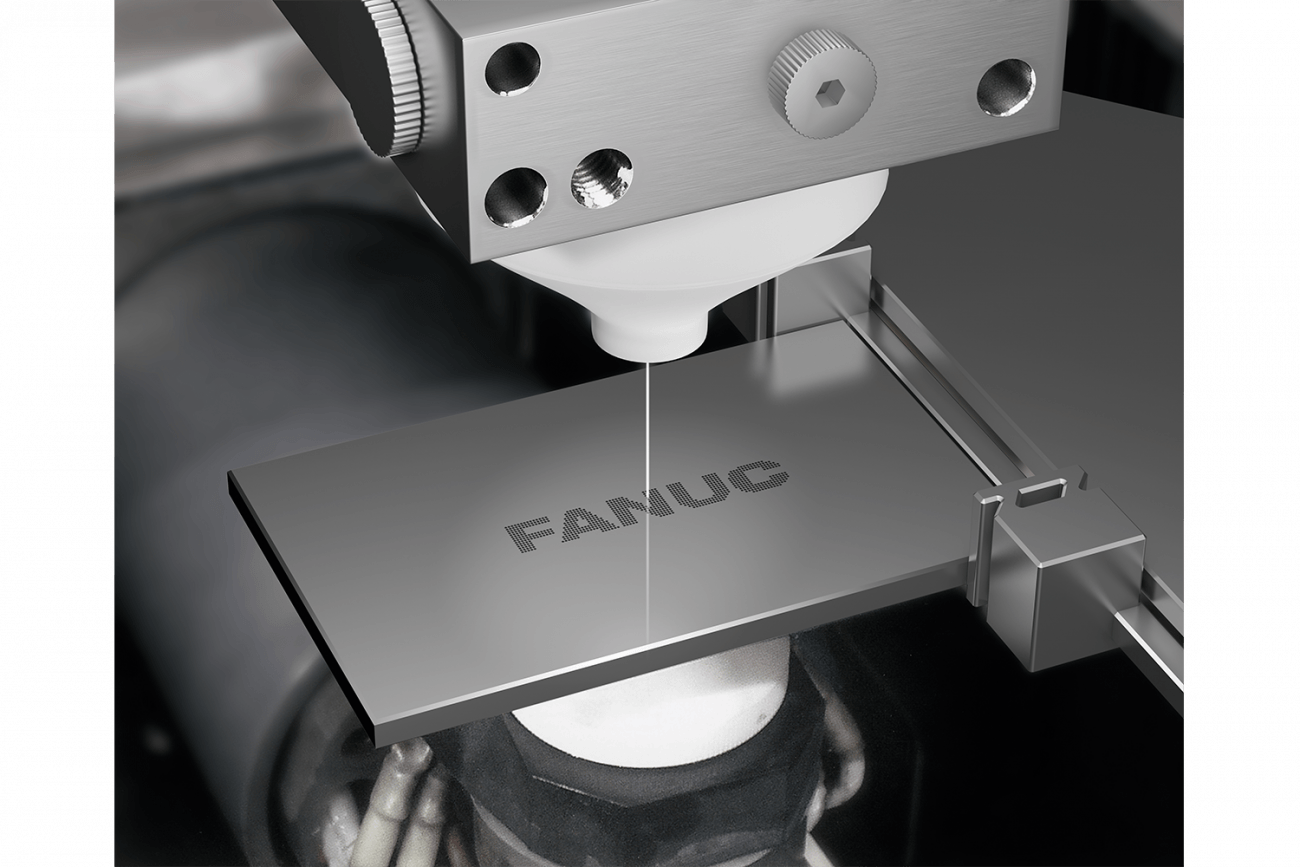 the FANUC RoboCut C600iC Wire EDM machine as it machines a part with the Fanuc logo